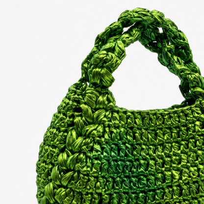 Borsa verde intrecciata dettaglio texture
